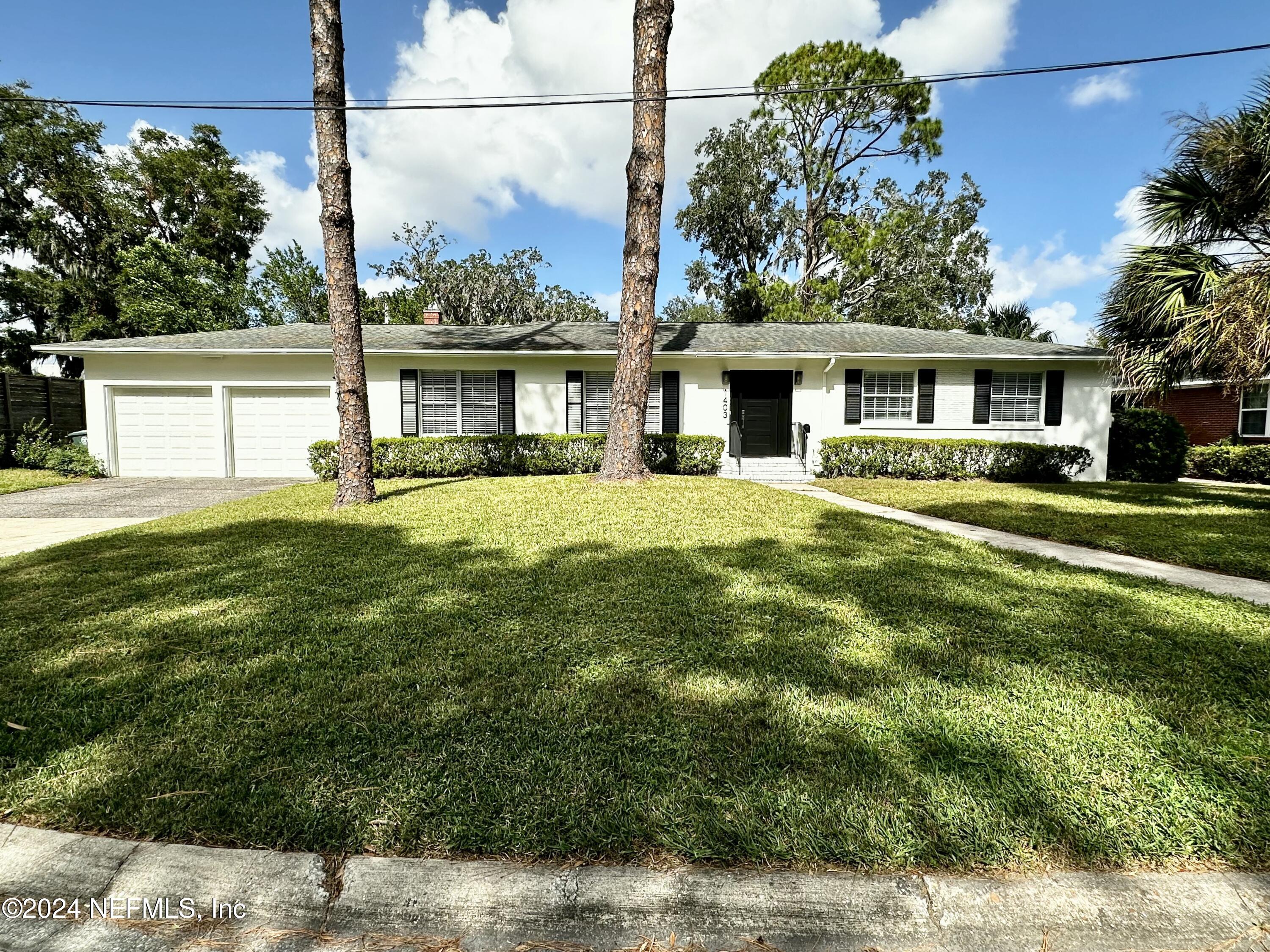 front view of a house with a yard