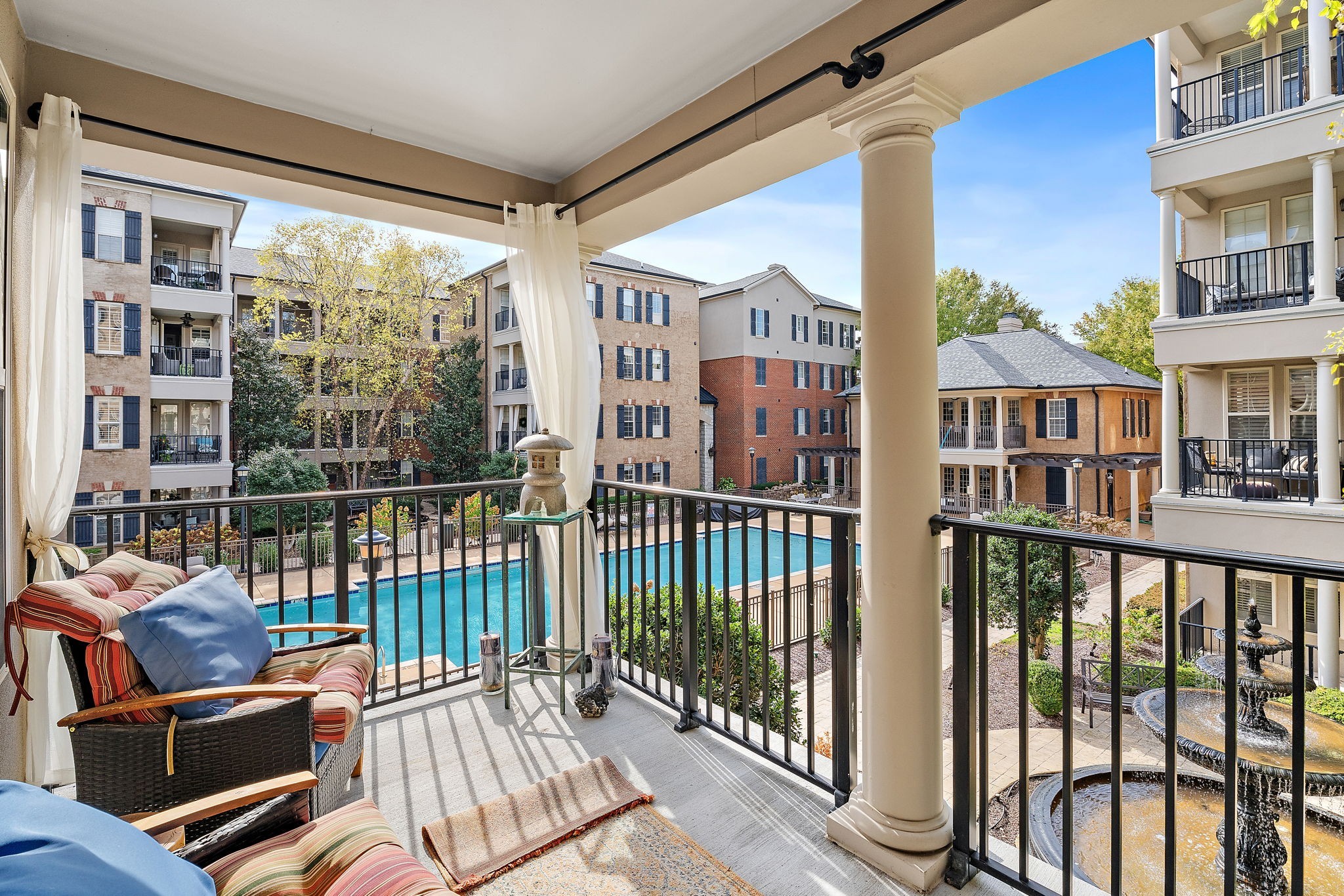 a view of a balcony with chairs