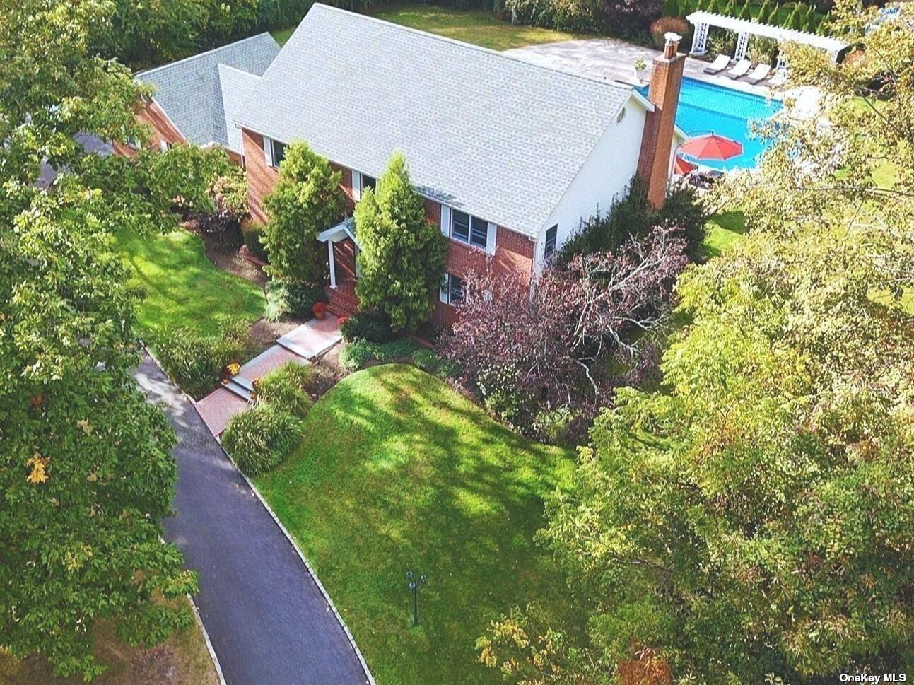 an aerial view of house with yard