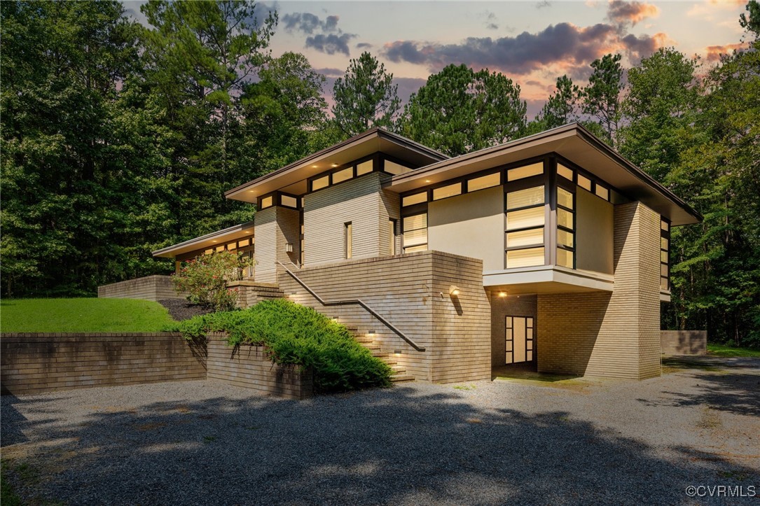 a house with trees in the background