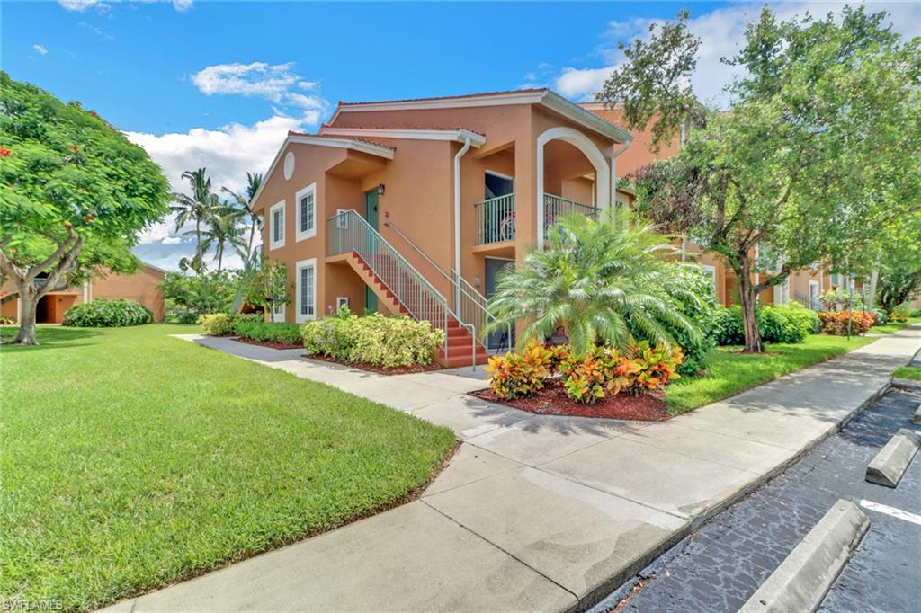 Mediterranean / spanish-style home with a balcony and a front yard