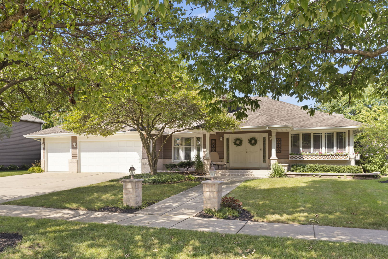 a front view of a house with garden