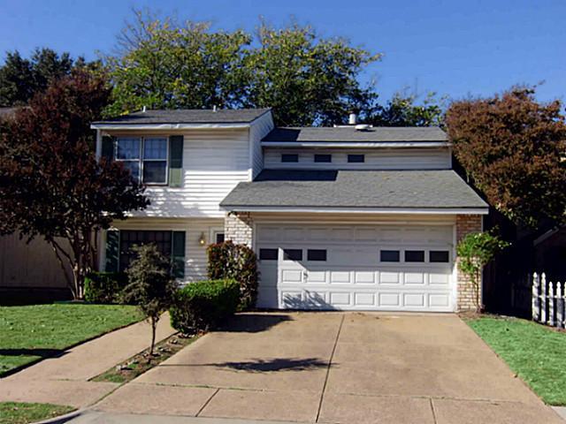 a house view with a garden space