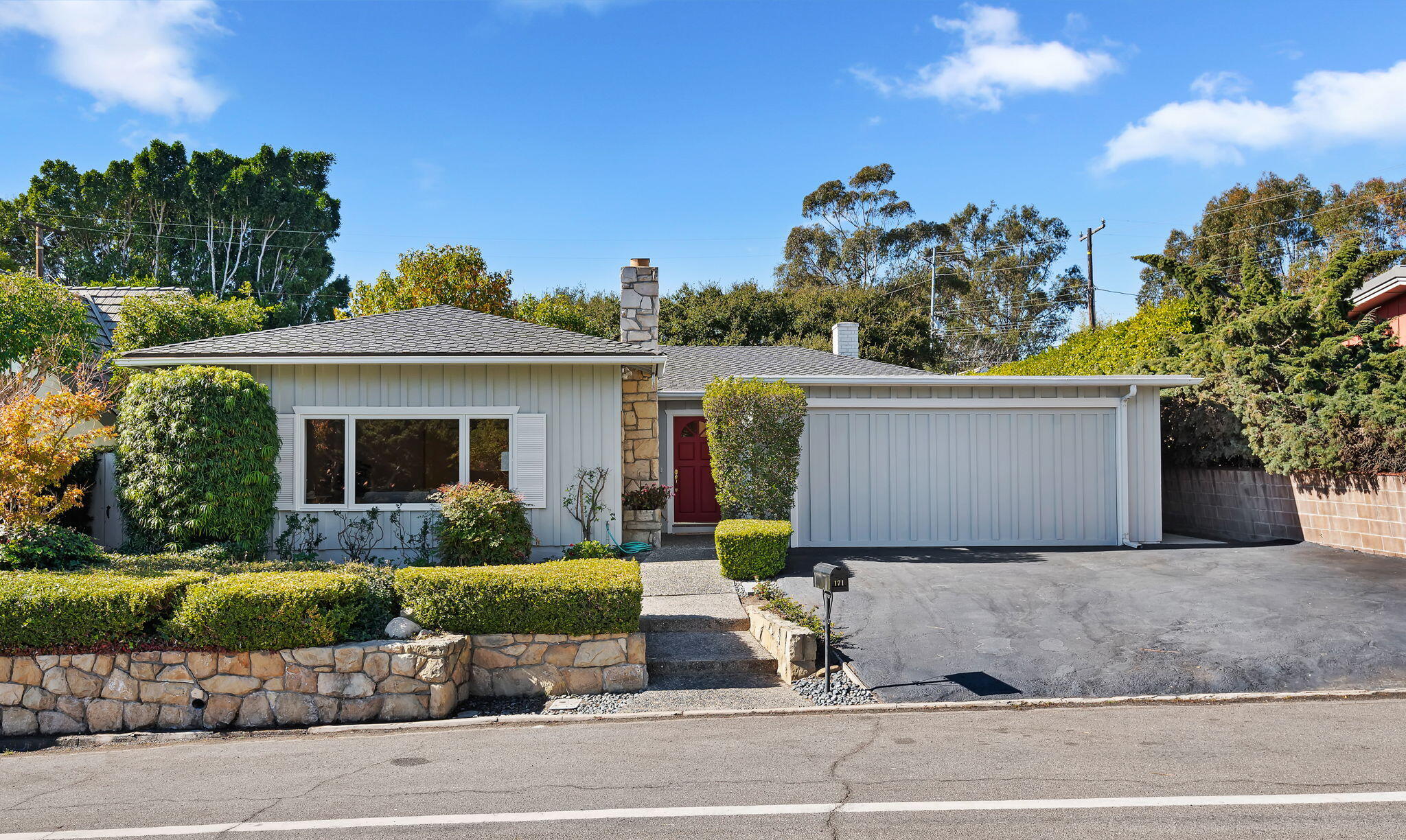 front view of a house with a yard