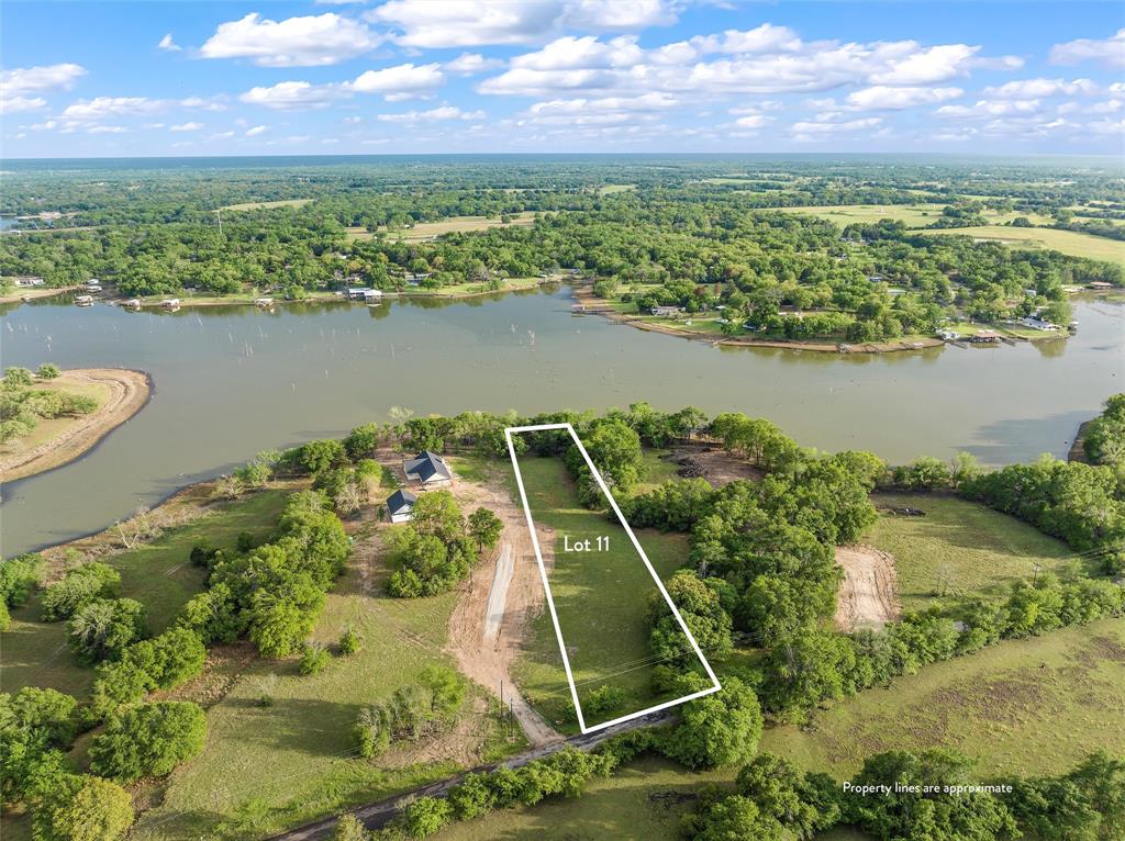 a view of a lake with a yard