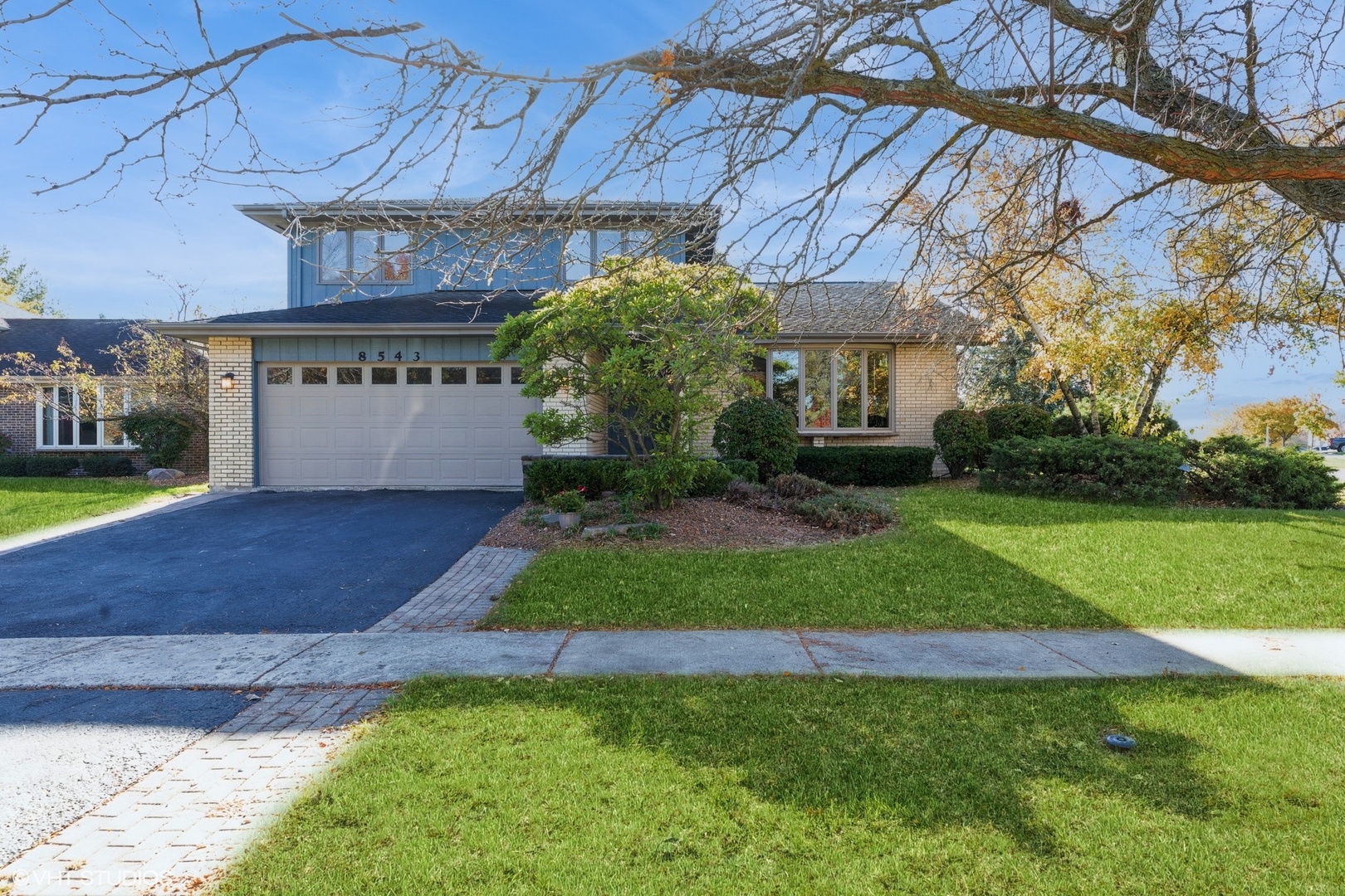 a view of a house with a yard