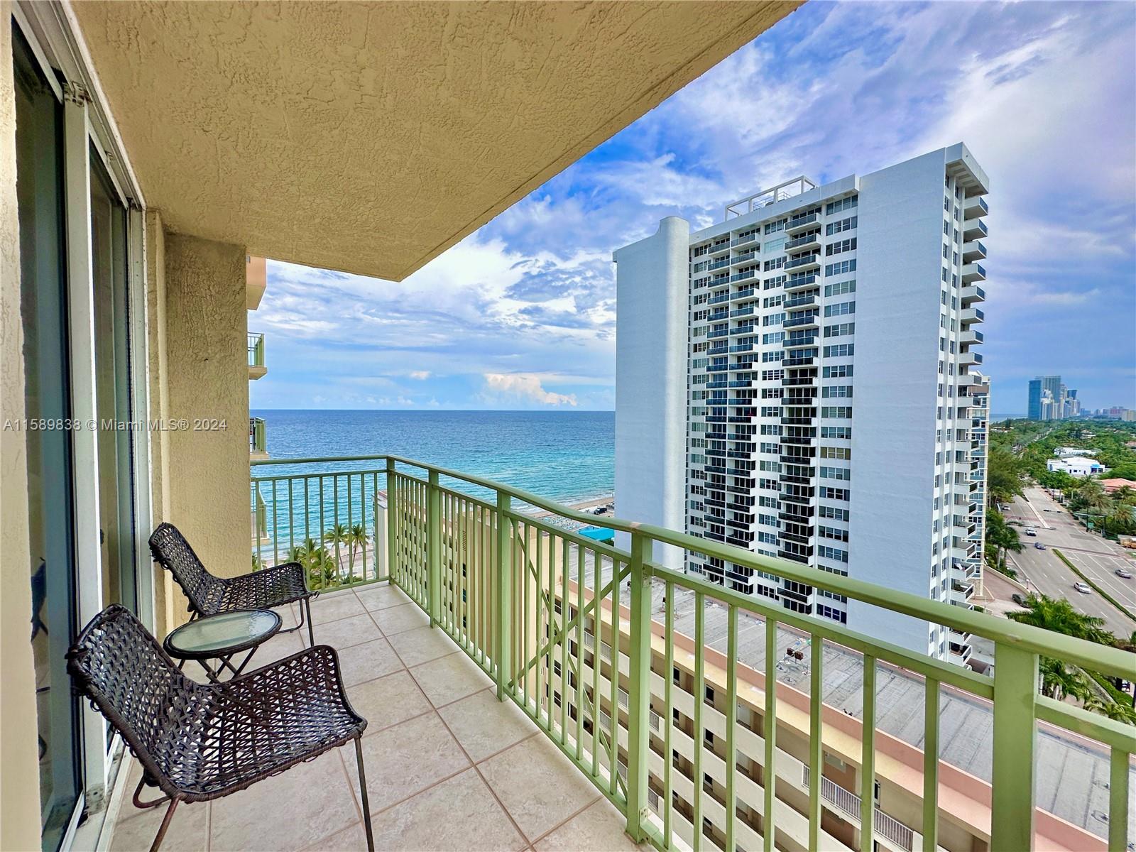 a view of balcony with chair and wooden floor