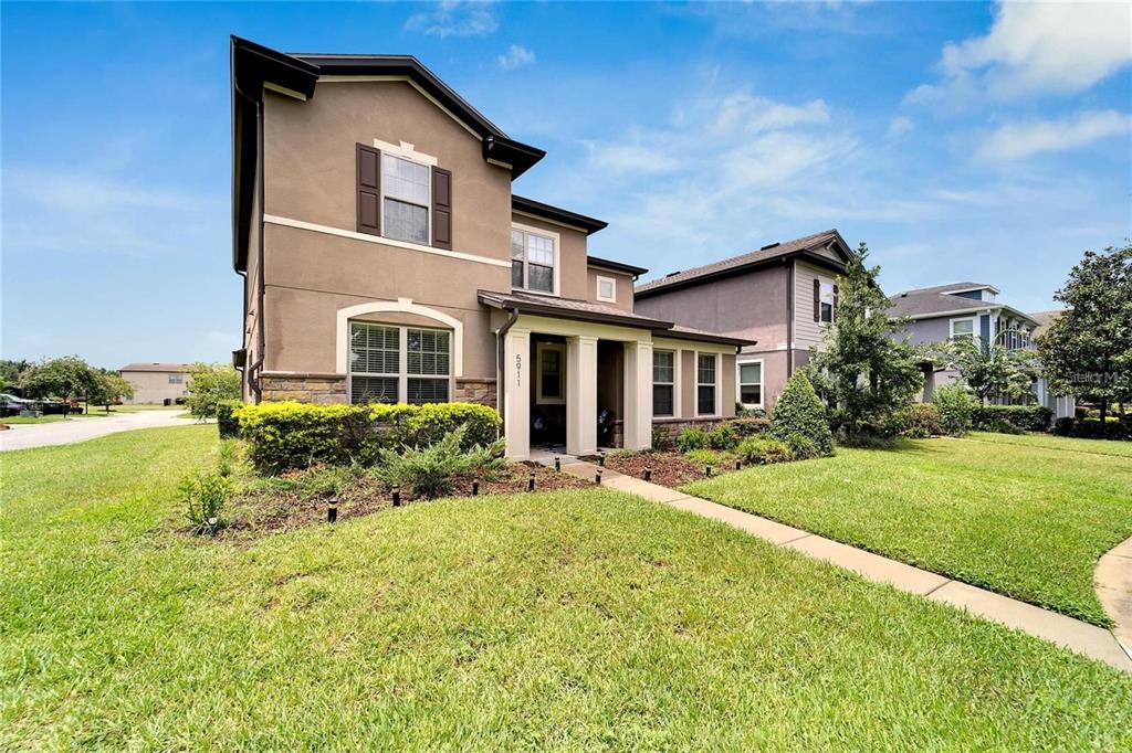 front view of a house with a yard