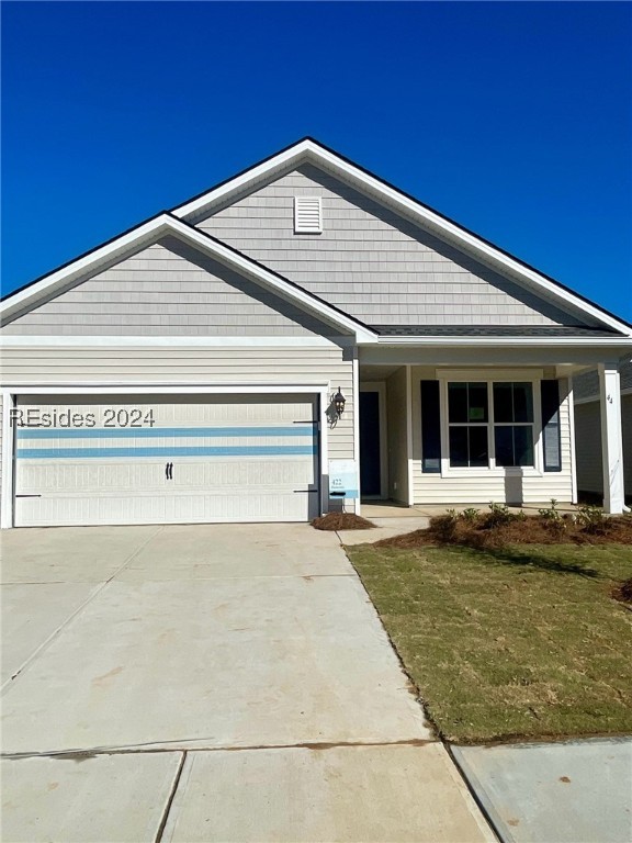 View of front of property featuring a garage and a