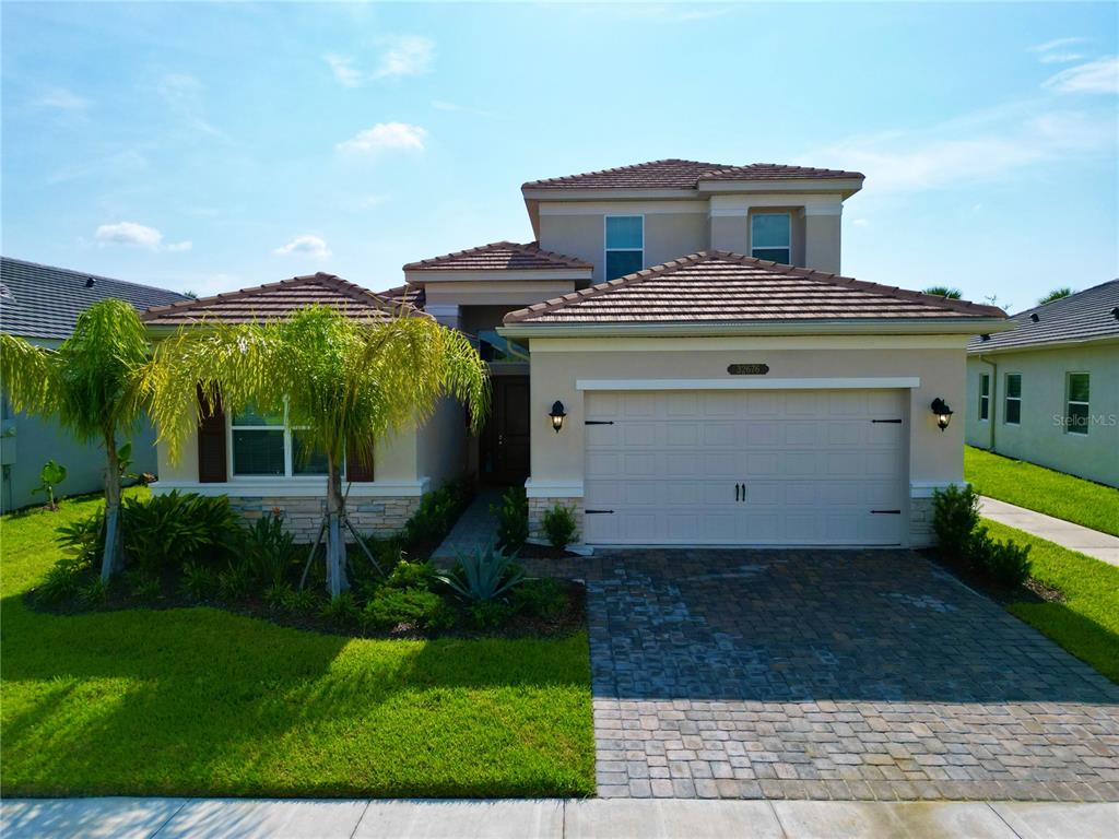 a front view of a house with a yard