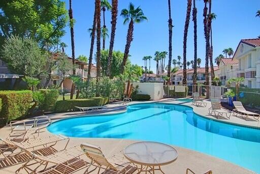 a view of a swimming pool with a patio