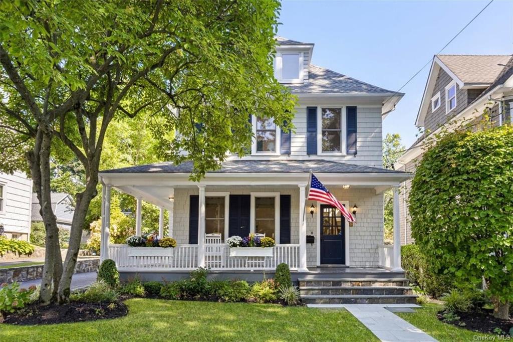 Welcome to 9 Redfield Street, a beautiful shingle style colonial home with wrap around front porch.