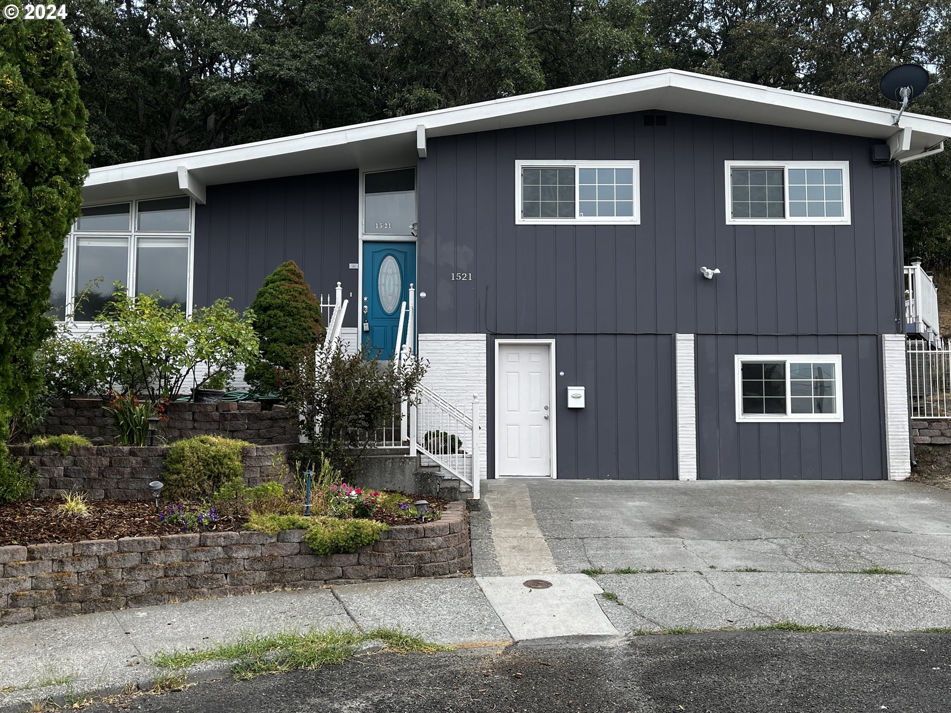 a front view of a house with garden