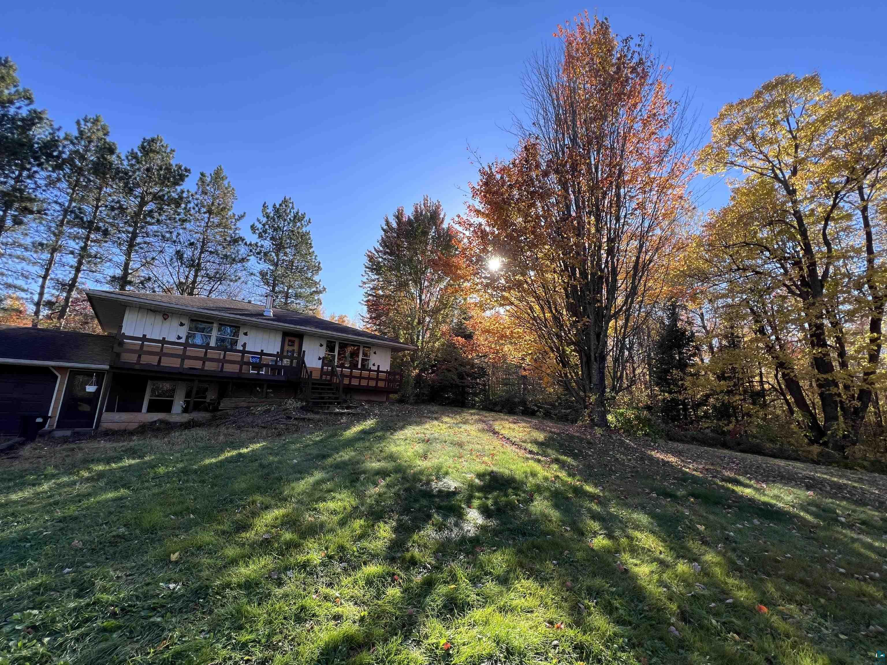 View of yard with a wooden deck