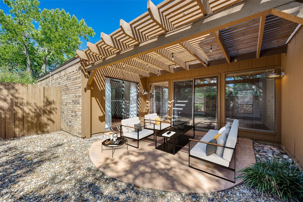 a building outdoor space with patio furniture and potted plants