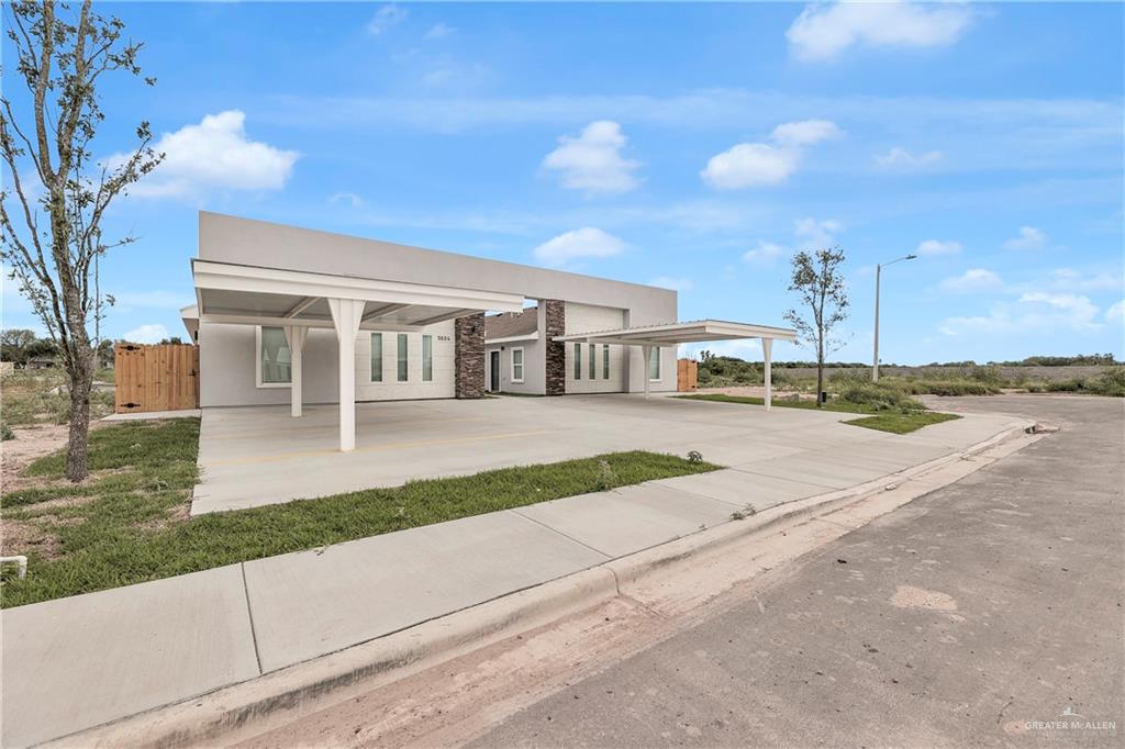 a view of a house with a street