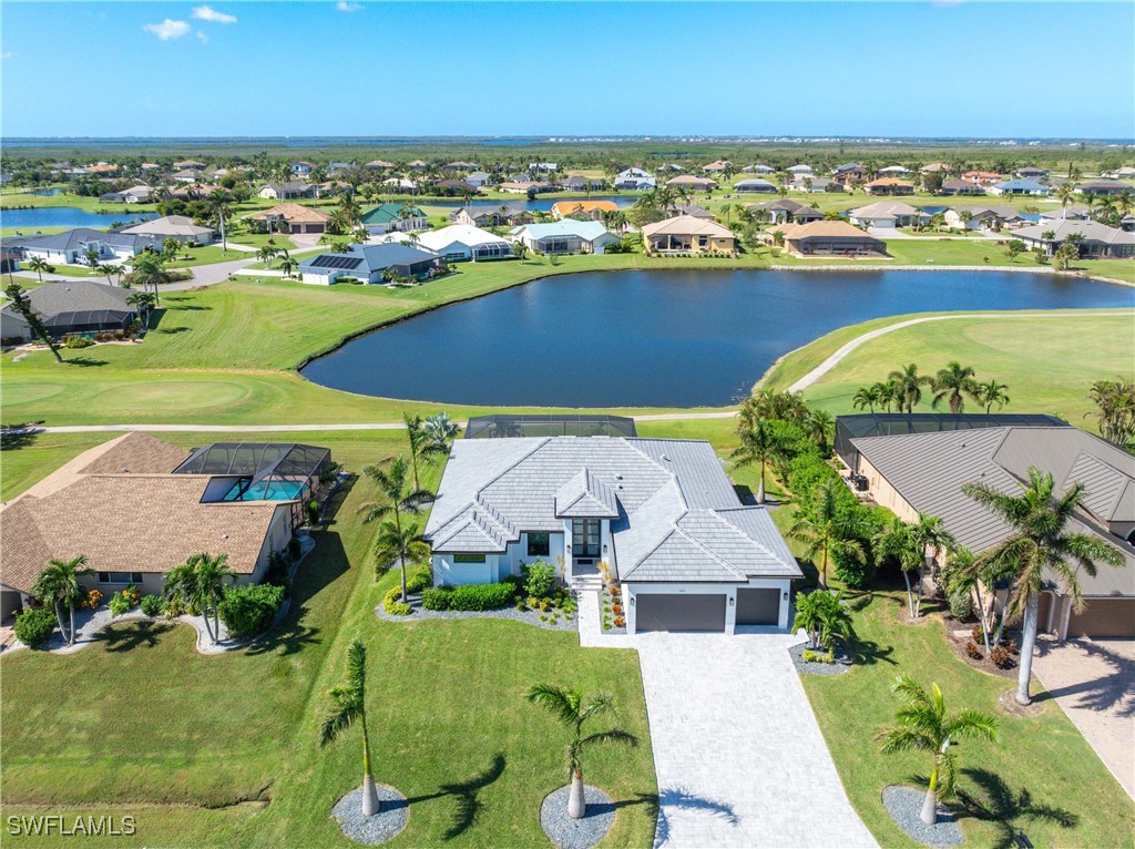 an aerial view of a house with a swimming pool yard and outdoor seating