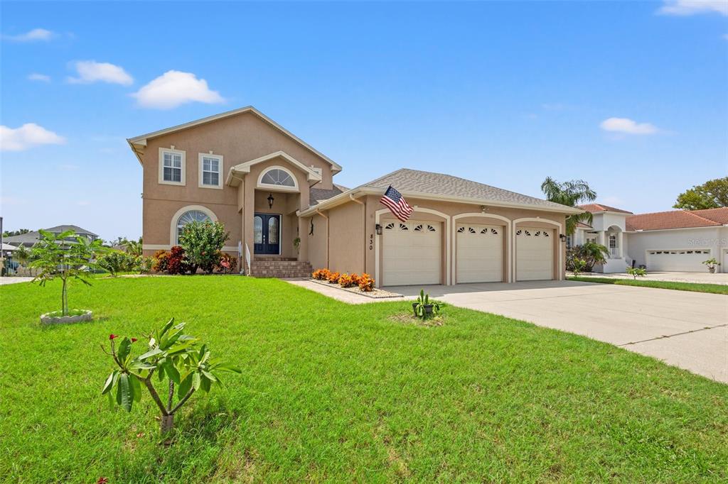 Front of this beautiful waterfront 4/3 home with a 3 car garage and nice elevation