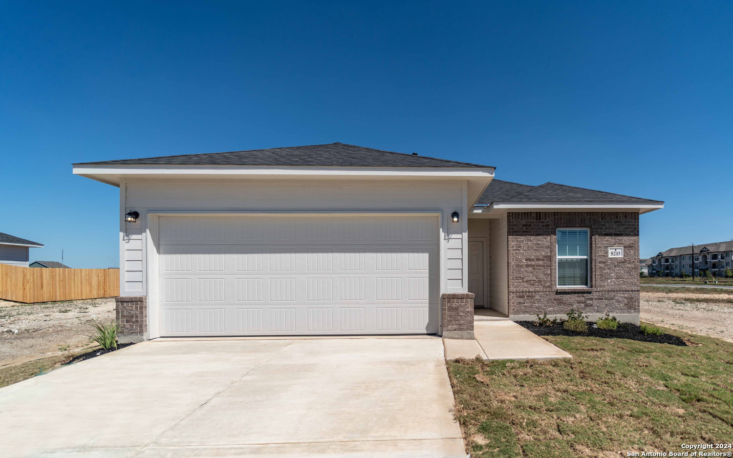 a front view of a house with yard