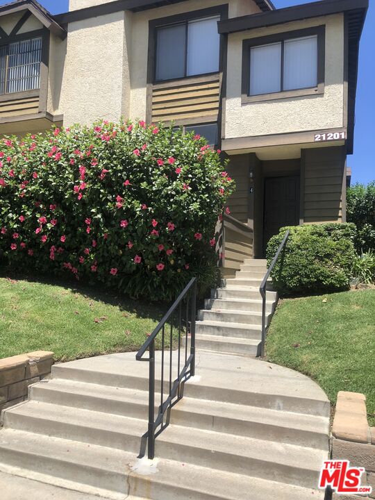 a house view with a garden space