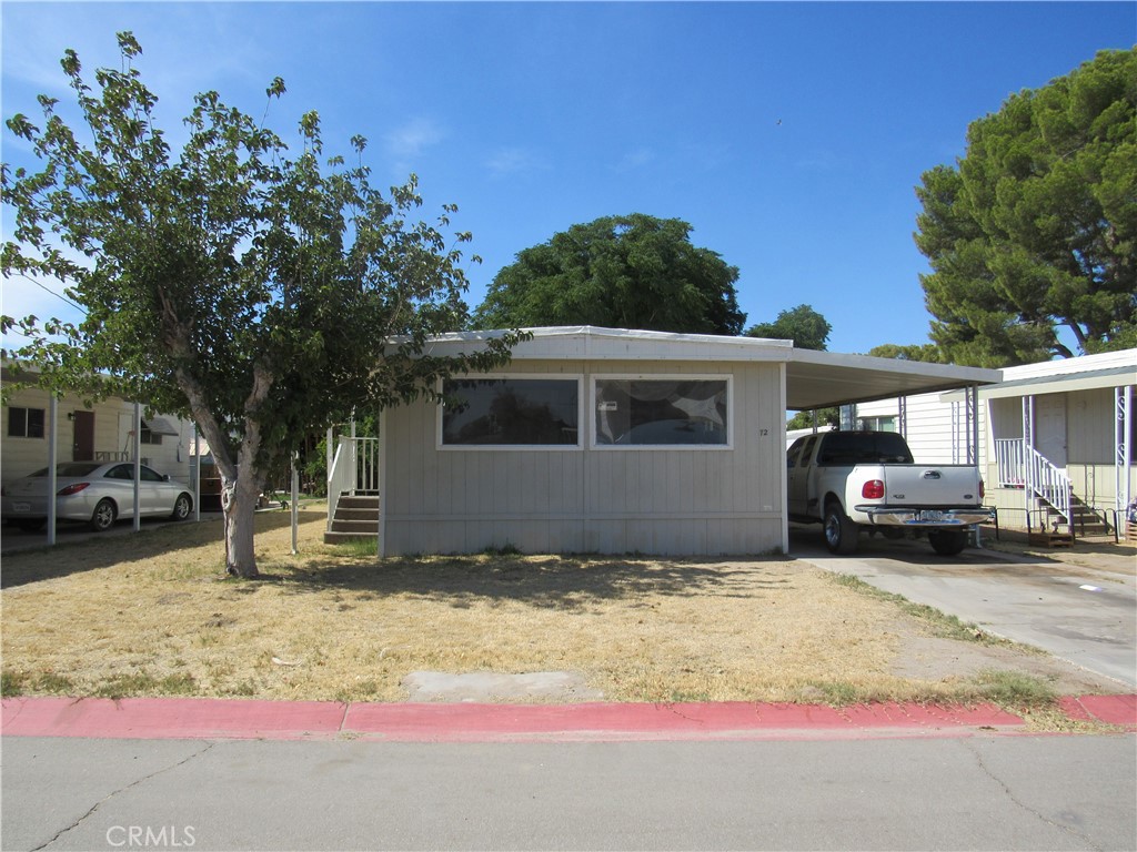 a view of a car park in front of house