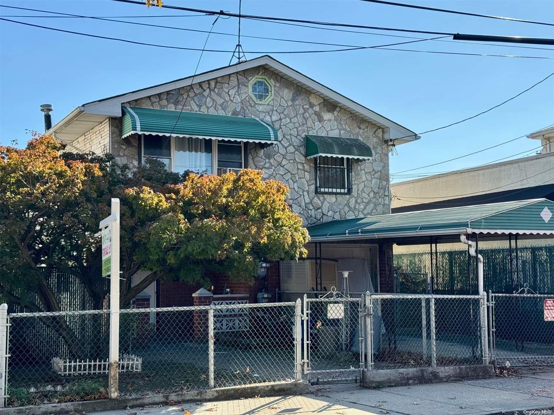 a front view of a house with parking