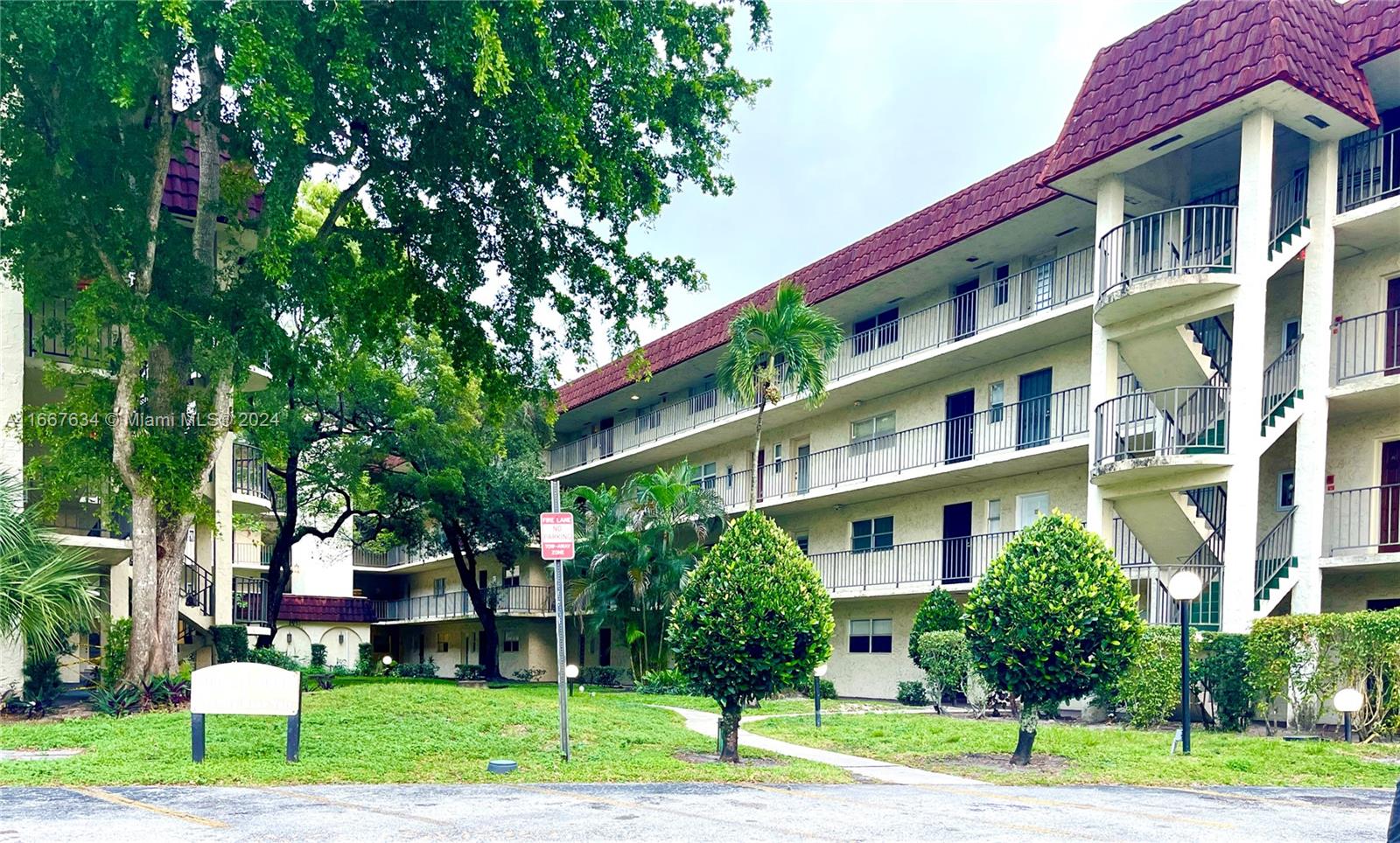 a front view of building with yard