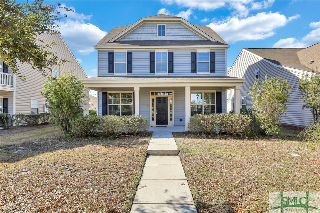 Beautiful front entry with mature landscaping.