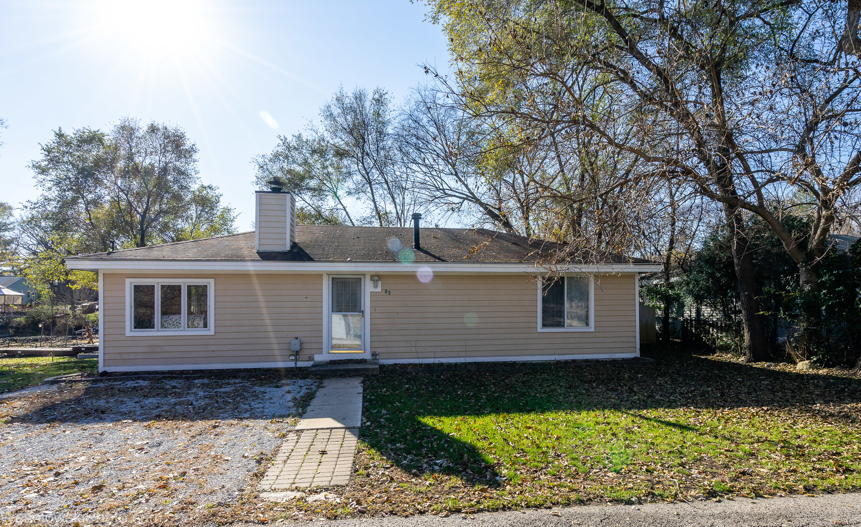 front view of a house with a yard