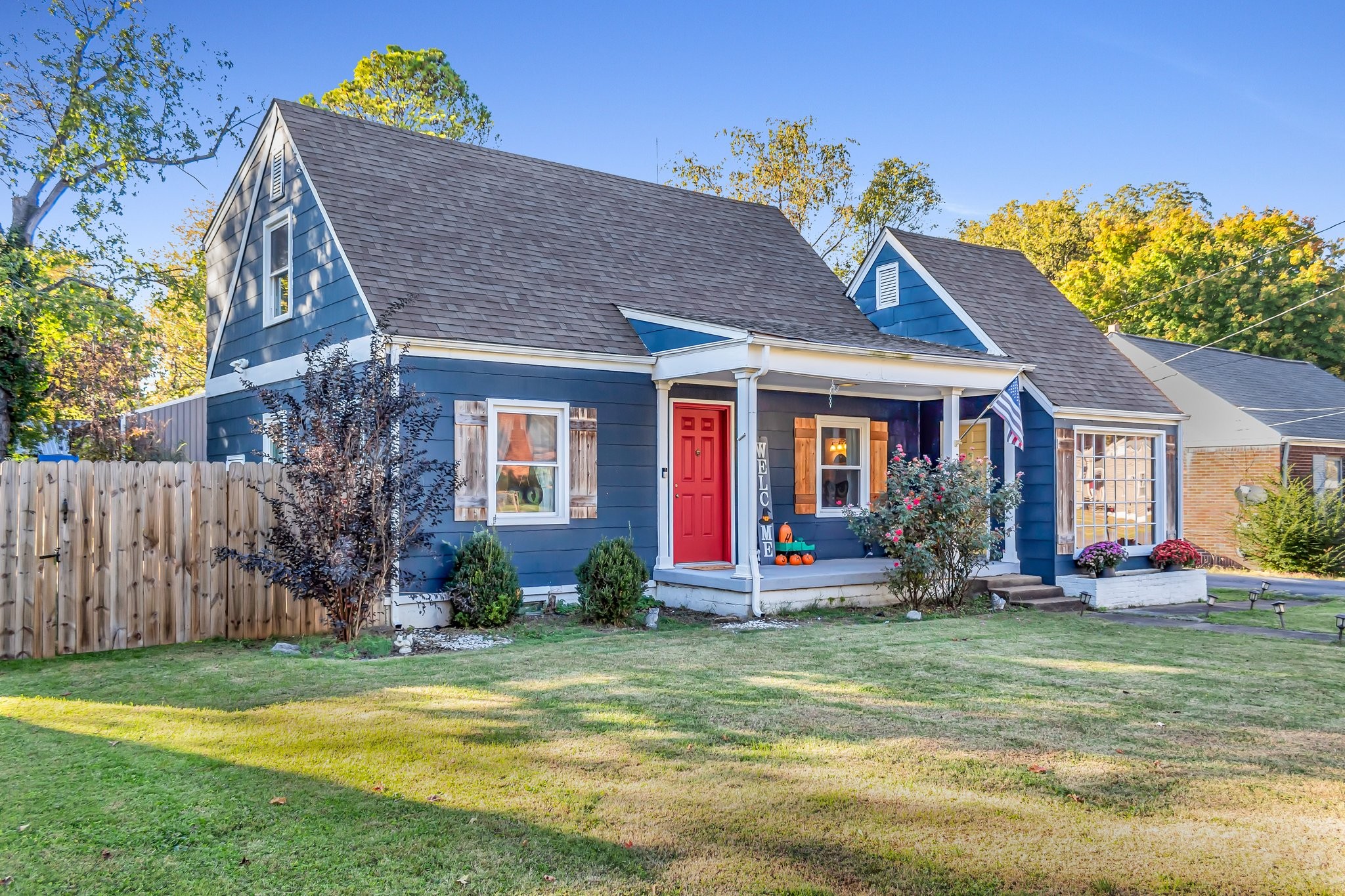 a front view of house with yard outdoor seating and barbeque oven