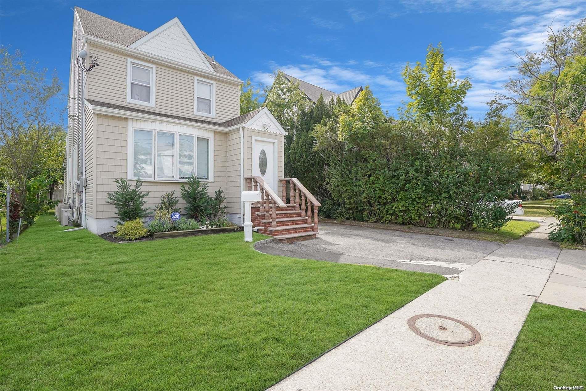 a aerial view of a house with a yard