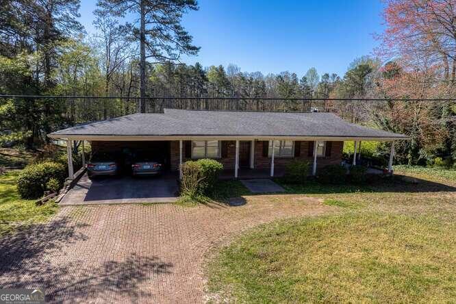 a view of house with yard and entertaining space