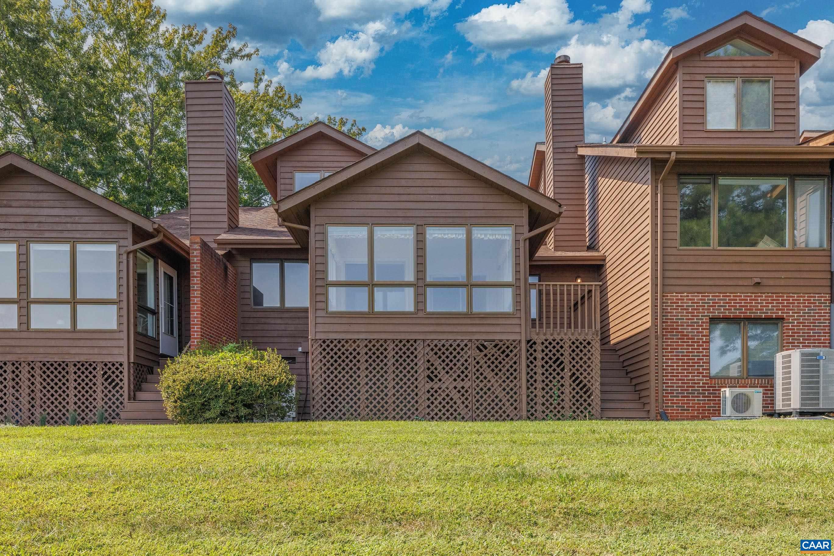 a view of front of house with a yard