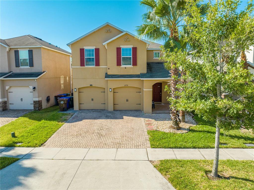 a front view of a house with a yard