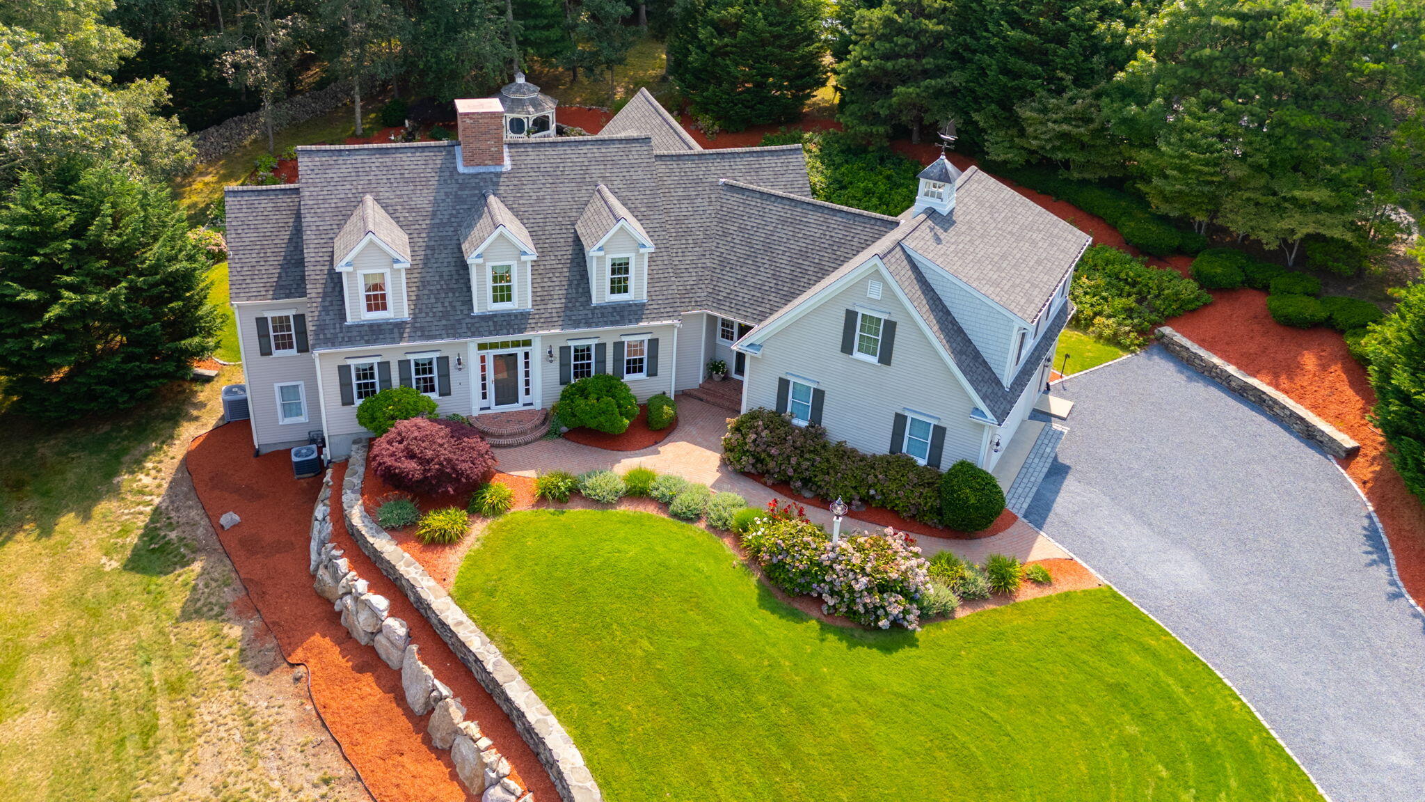 a aerial view of a house with swimming pool and garden