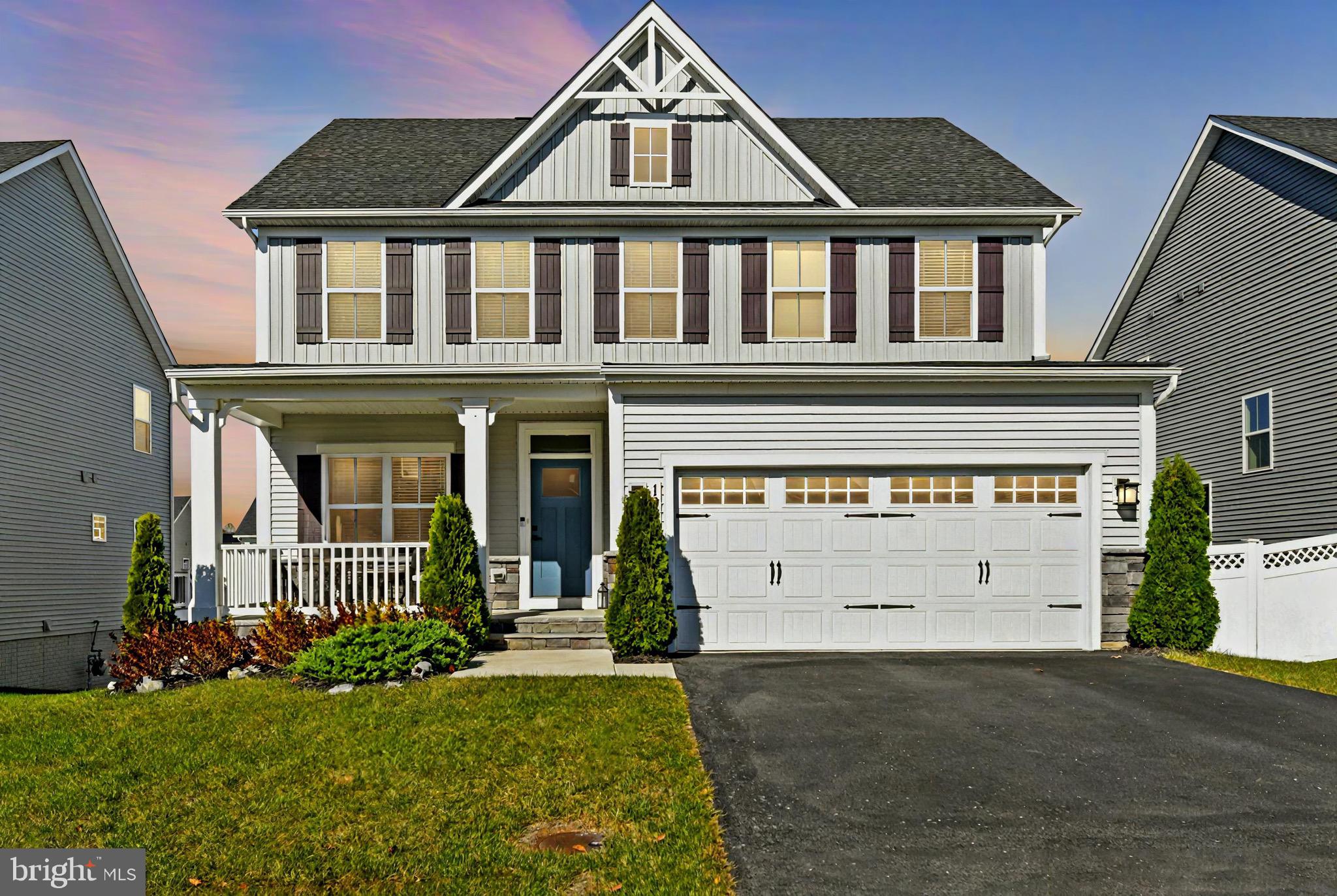 front view of a house with a yard