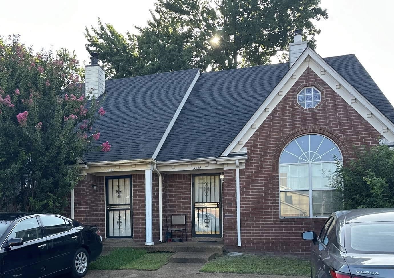 a front view of a house with a garden