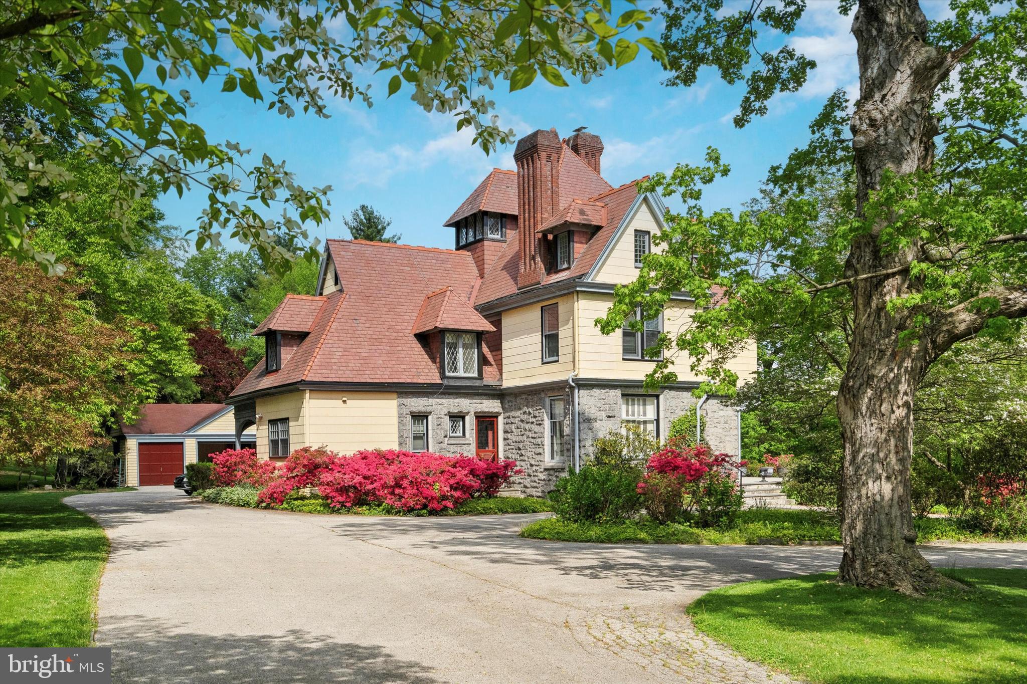 front view of a house next to a yard