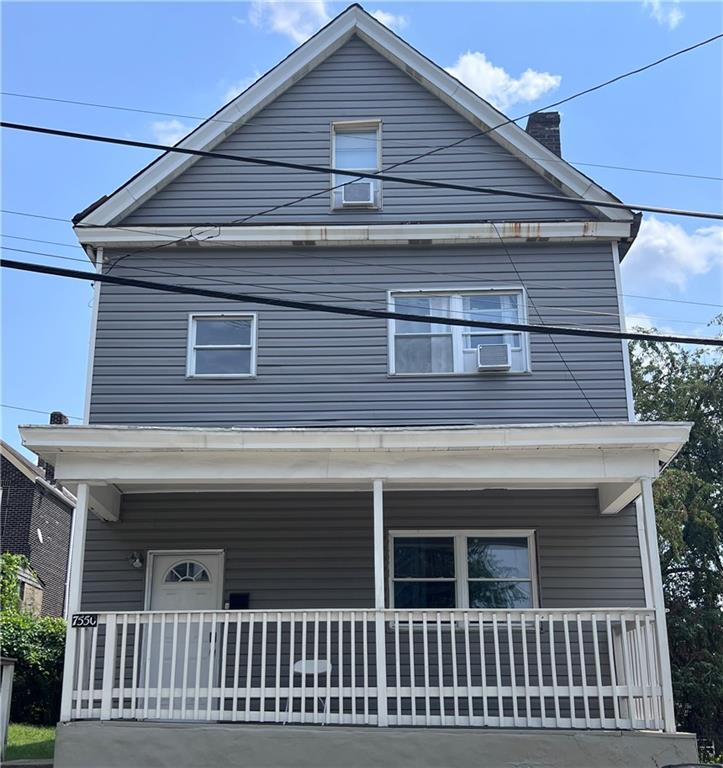 a front view of a house with a balcony