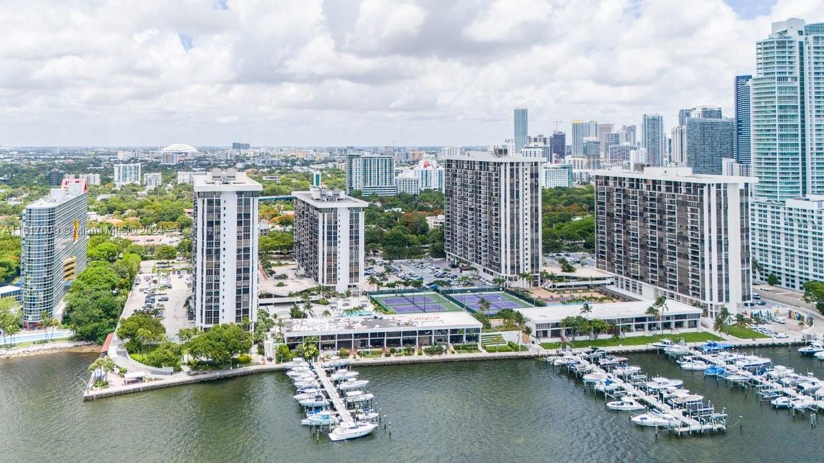 a view of a lake with tall buildings