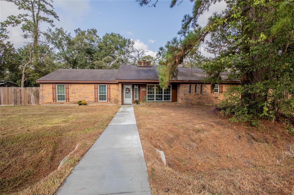 a house with trees in the background