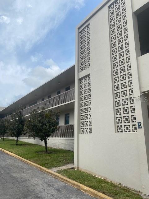 a front view of a building with garden