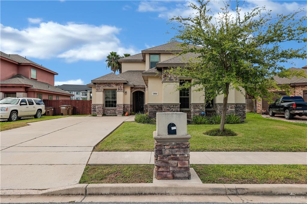 View of front of property featuring a front yard