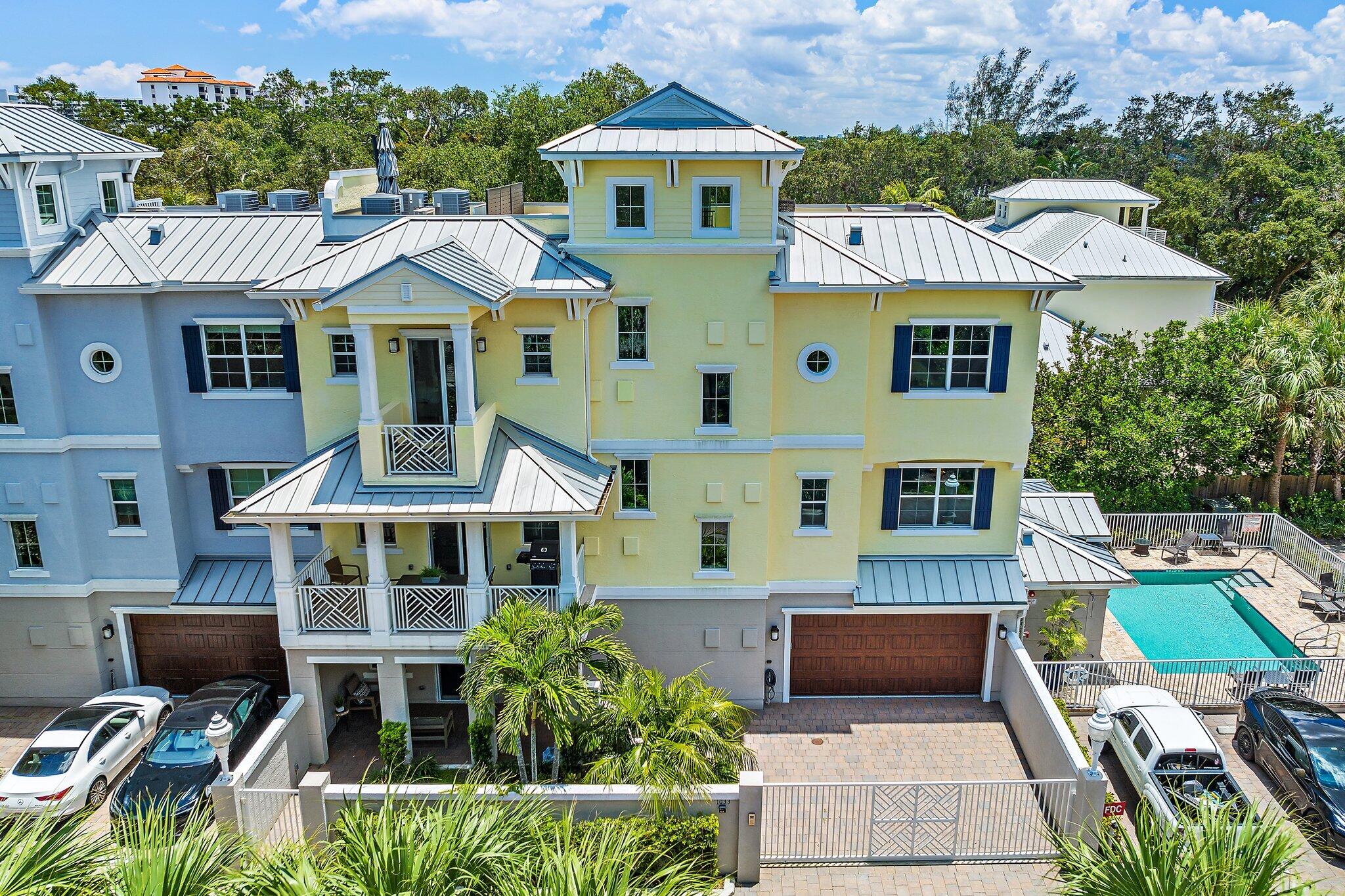 an aerial view of a house with a yard