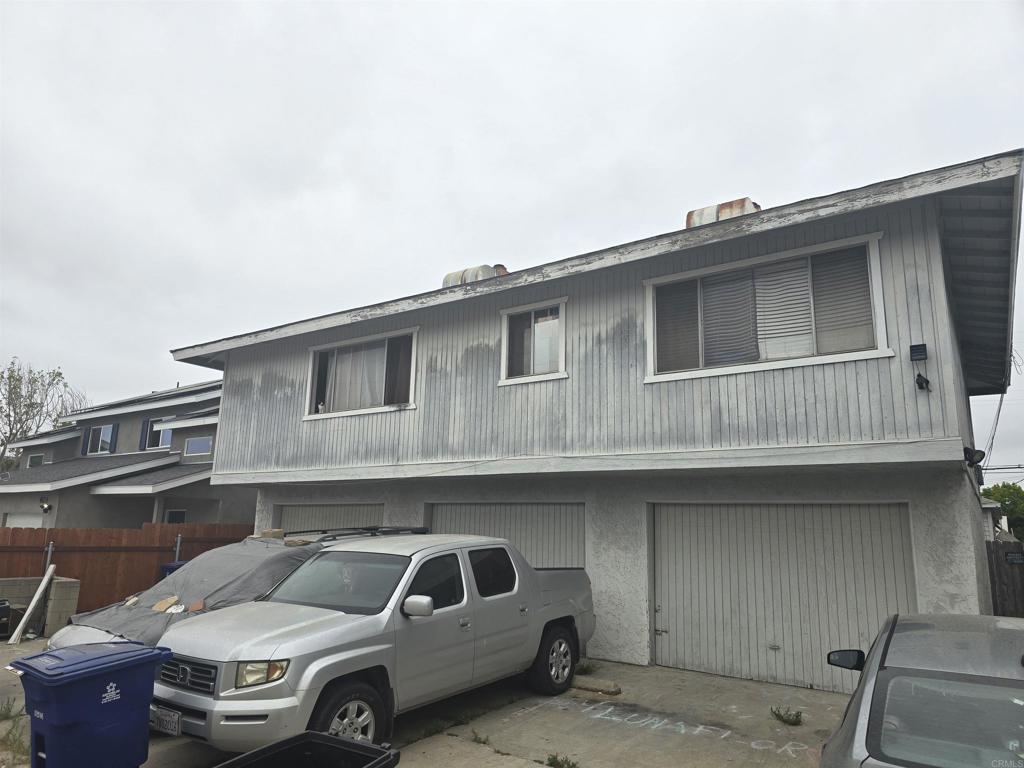 a front view of a house with parking space