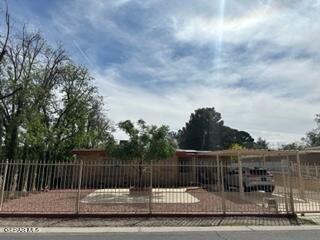 a view of a wrought iron fences in front of house