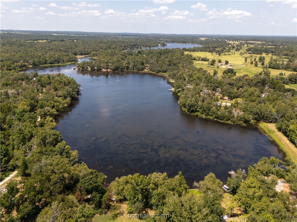 a view of a lake with a yard