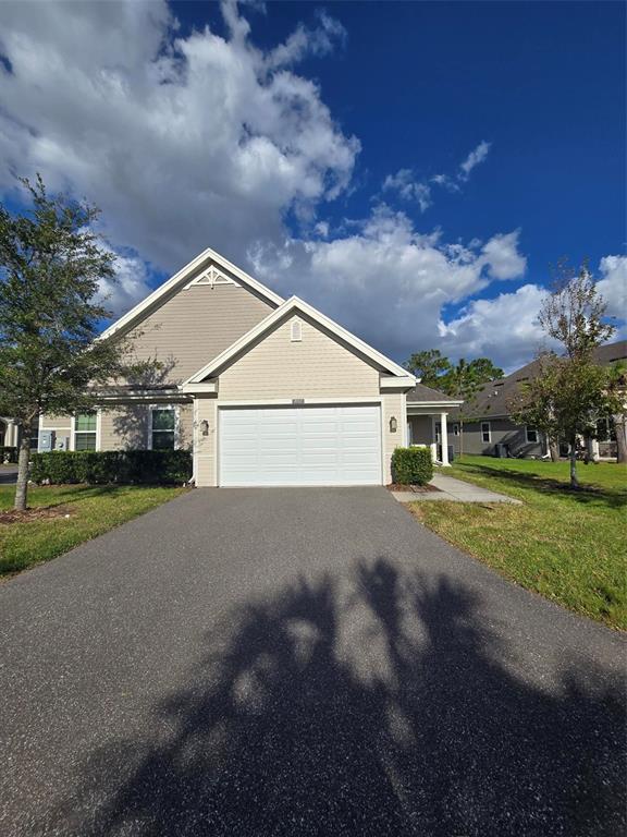 a view of house with outdoor space and street view