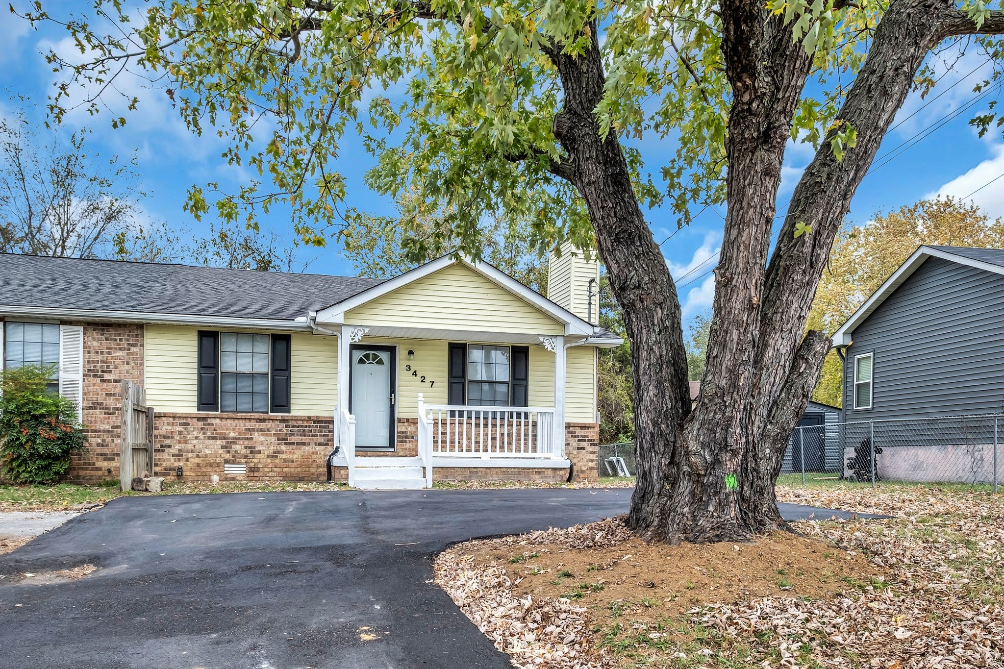 front view of a house with a yard