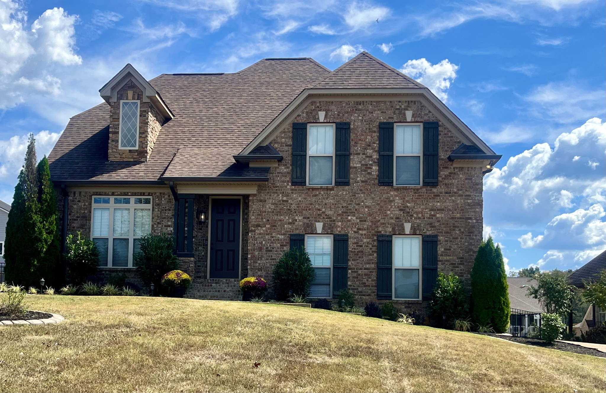 a front view of a house with a yard